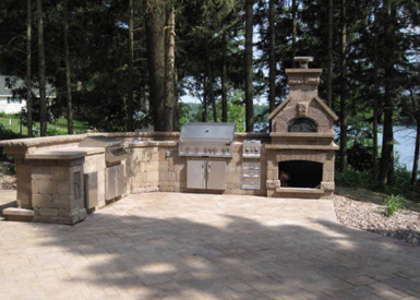Outdoor kitchen, fireplace, and patio